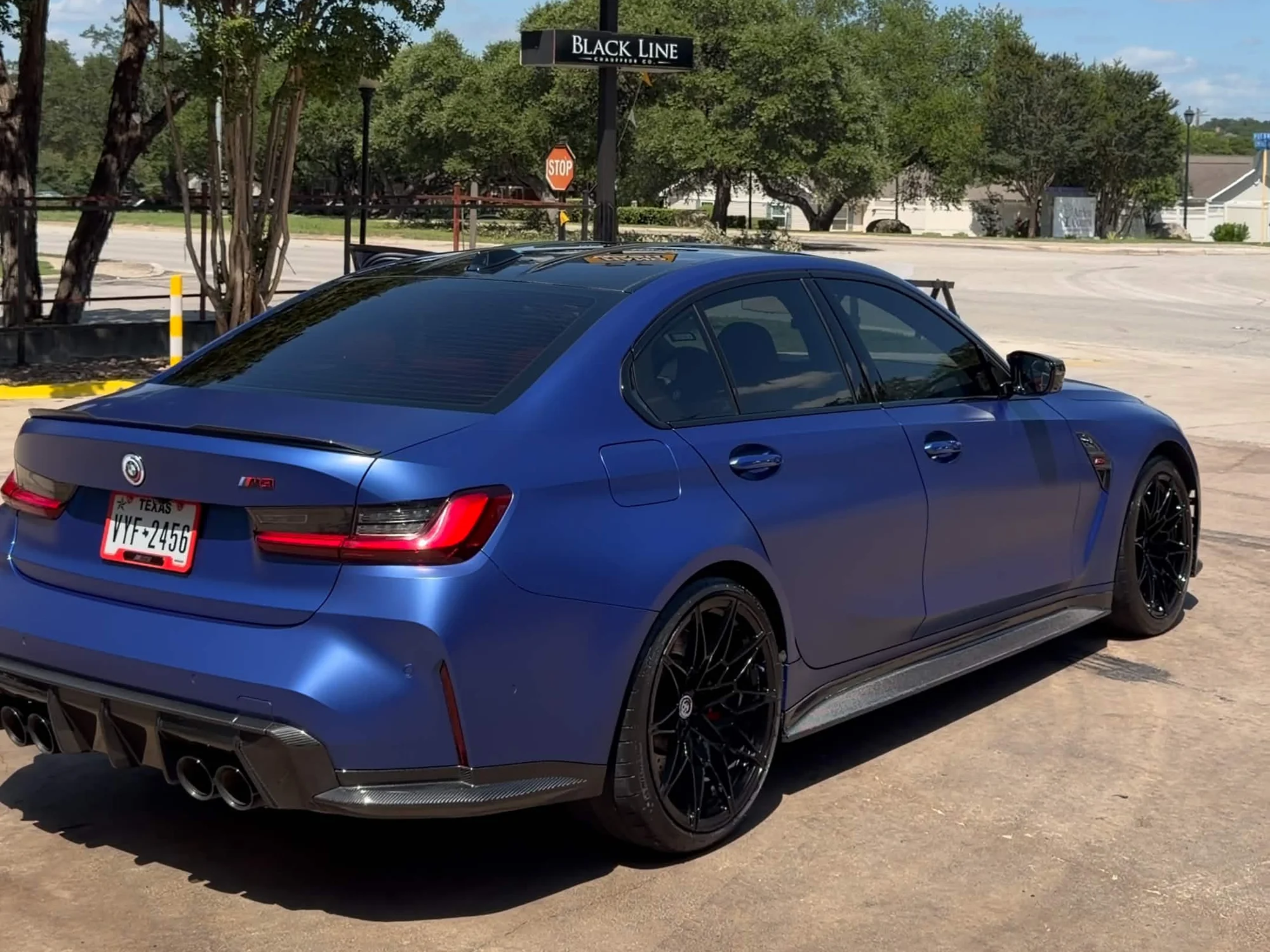 Clean blue BMW sedan after a hand wash at The Hand Wash San Antonio